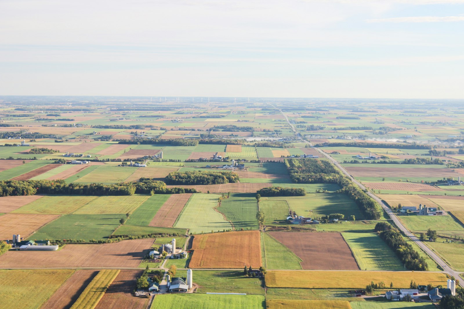 Aerial view of patchwork farm parcels and rural roads